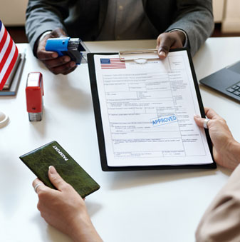 Hand of employer at the desk reviewing documents